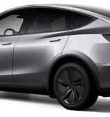 a silver tesla model with a rear view of the vehicle