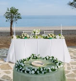 a wedding table with a wedding setting on beach