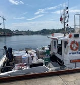 a boat with a large amount of bags on it