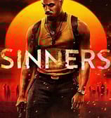 Black man standing in backdrop of moon with the word SINNERS written across chest