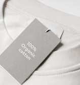 white t-shirt with tag that says '100% organic cotton'