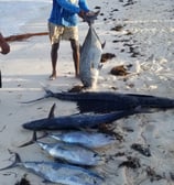 a man holding a fishing rod rod and a fishing rod