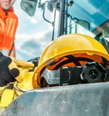 a construction worker in a helmet and safety gear