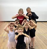 a group of children and adults posing for a picture