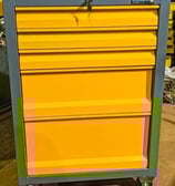 A yellow tool trolley with 5 drawers