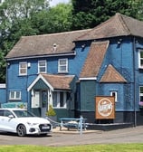 a country pub with a traffic light