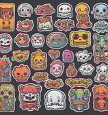 A creative studio space featuring a letterpress and linoprint workshop with printed artworks and tools. Posters with inspirational messages are suspended from the ceiling. A well-organized, artistic workspace with a wooden type cabinet and various paper materials. The room is bright and airy, with a window providing natural light.