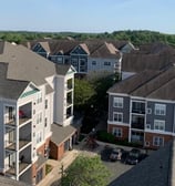 Aerial view of an apartment complex exterior painting project by Garnet Painting & Remodeling in Douglas, GA.