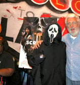 Nightmare Cafe Las Vegas trivia winners Sam Glass and Woody Goulart with Ghost Face character