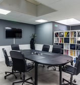a conference room with a table and chairs