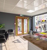 a desk with a computer and a desk with a computer