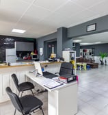 a desk with a laptop and a laptop on it