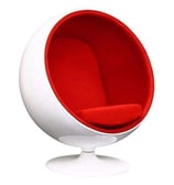 a white ball chair with a red cushion