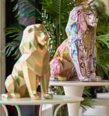 a lion statue sitting on a table