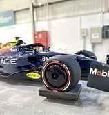 a red bull racing car in a garage
