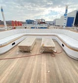 dinc design luxury yacht seating area with outdoor and indoor seating cushions.