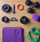 A well-stocked shop shelf filled with various beauty and wellness products, including bottles, boxes, and jars. The shelves are neatly organized with different color-coded sections containing skincare bottles, soaps, and colorful packaging. The lighting is warm and inviting.