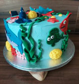 a cake with a fish and fish on it