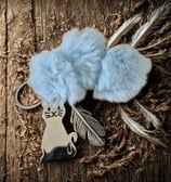 a keychain with a cat on it