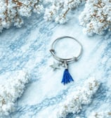 a keychain with a starfish charm on it