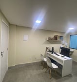 a desk with a laptop and a laptop on it