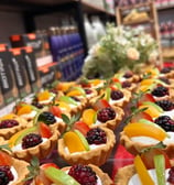 a variety of desserts on display in a store