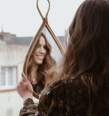 A women's haircut in a mirror