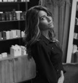 a woman in a black and white photo after a haircut