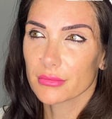 a woman with a pink lipstick and a pink lipstick