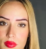 a woman with blonde hair and red lipstick