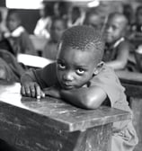 Rural village in Africa, kids is glass, watching the viewers with big eyes