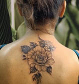 a woman with a tattoo on her back