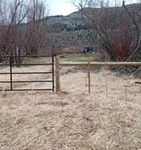 Range fence installation in conservation area to control cattle access. South Okanagan