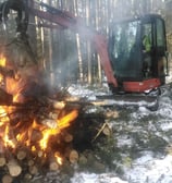 Firesmart debris pile burning using excavator. Kootenay region.