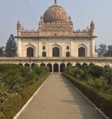 a large building with a dome shaped building in the middle