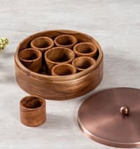 a wooden box with a wooden lid and a vase with flowers