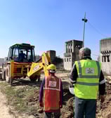 On-site trench excavation by Gavi Infra for civil EPC project – JCB machinery and field engineers in