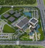 a large building with a lot of trees and a lot of grass