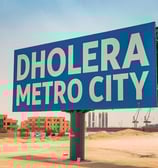 a sign that says dholera metro city