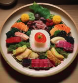 A cozy setting featuring a traditional Japanese meal with a bubbling hot pot filled with vegetables and tofu, accompanied by a plate of green soba noodles being lifted with chopsticks. Assorted tempura and dipping sauces complete the meal, set against a wooden table with an intricate design on the hot pot base.