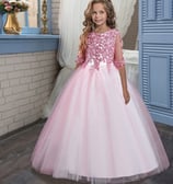a young girl in a pink special occasion party dress with a beautiful sparkling floral bodice