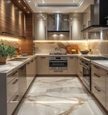 Luxurious modern kitchen with marble finishes and warm ambient lighting.