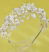 a tiaper headband with pearls and crystals
