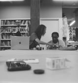 a woman and a man sitting at a table