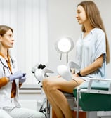 a doctor and a patient in a hospital room