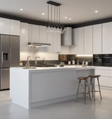 A kitchen with dark wood cabinetry and beige countertops, illuminated by overhead lighting. Several kitchen appliances, including a stove, a blender, and a microwave, are visible. Various kitchen utensils hang from the wall, and a window is positioned above the sink. There are dishes drying on a rack near the sink.