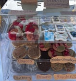 many flavored cookies displayed for sale