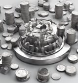 a person holding a credit card in front of a computer