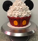 a mickey mouse cupcake with a mickey mouse ears