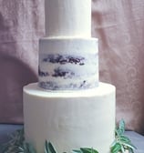 a cake with a white frosted cake topper